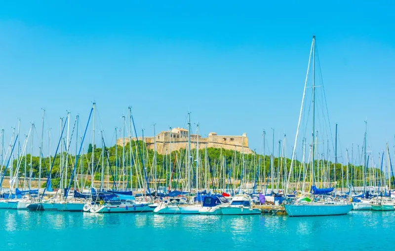 Antibes marina with sailboats and Fort Carré