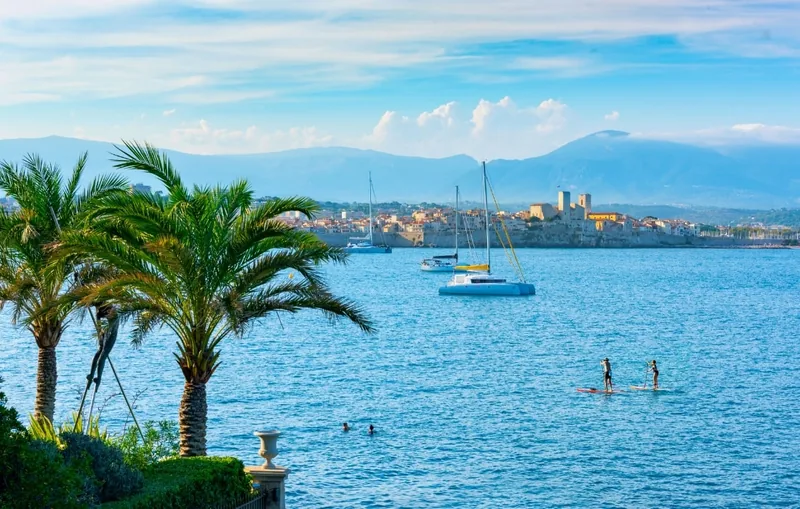 Antibes bay with paddleboarders and Mediterranean coast